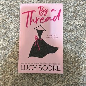 “By a Thread” by Lucy score